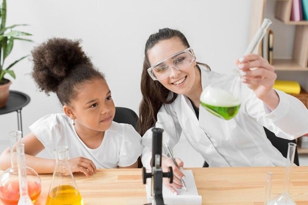image of student and teacher doing science experiment for STEM learning STEM Teaching Tips